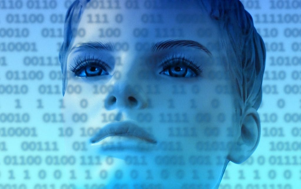 intelligent design - woman looking at binary code