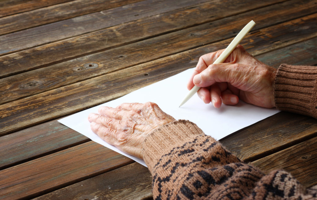 Grandmother writing a legacy