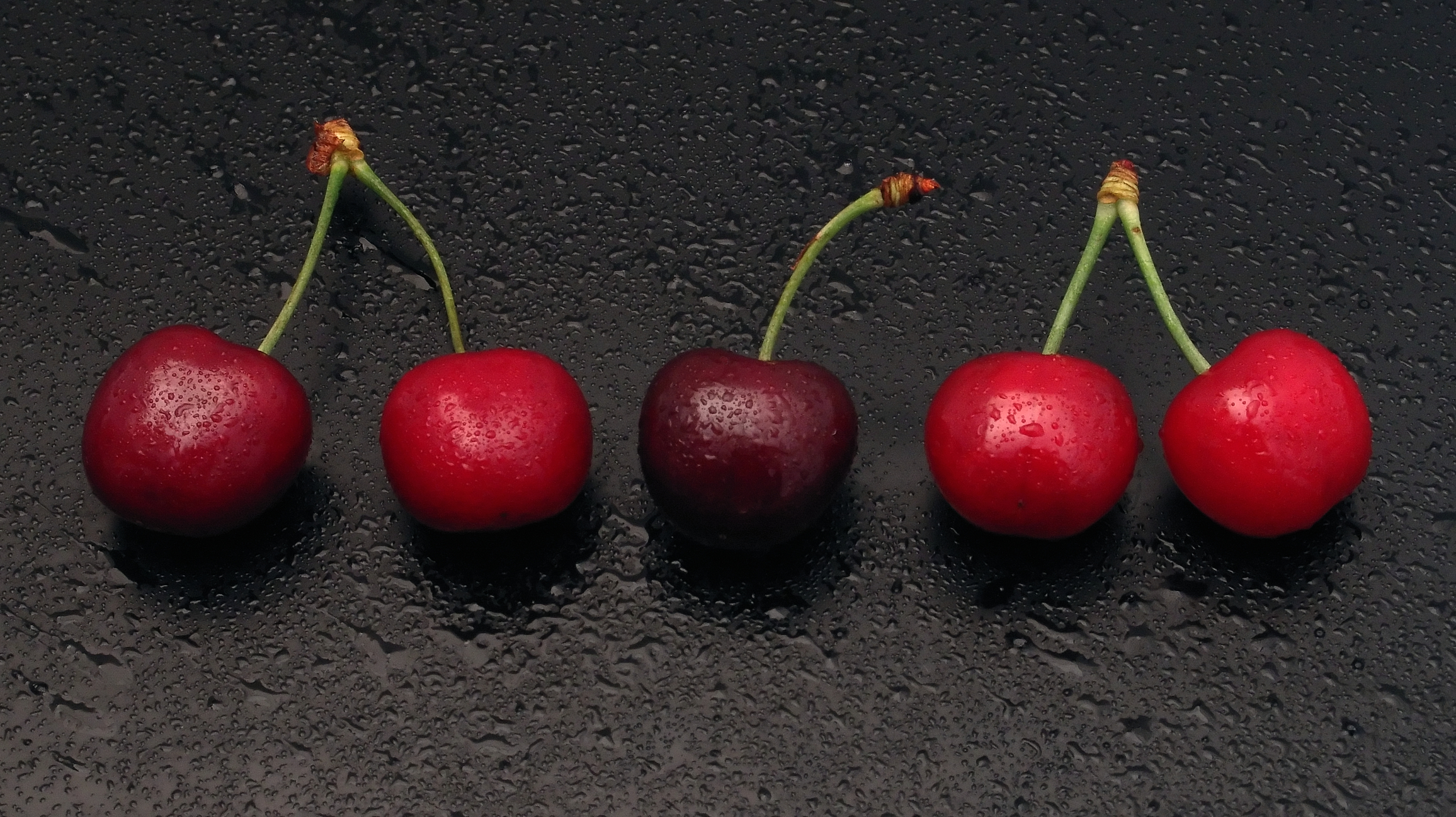 Paris of cherries and one single cherry