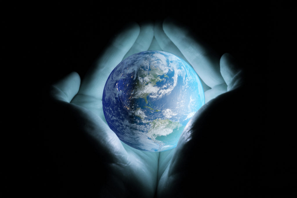 kingdom of God - God holding earth in His hands